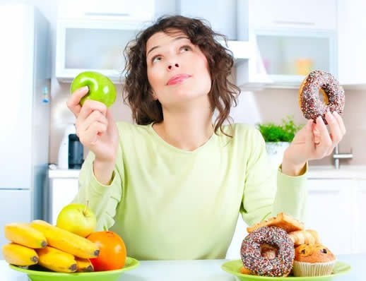 dietitian-guide-to-indulgence-woman-choosing-to-eat-fruit-or-donut-mq2mt9k85ltlkeqjaxnd08xcsj8mtpc3r1dych8xl8.jpg